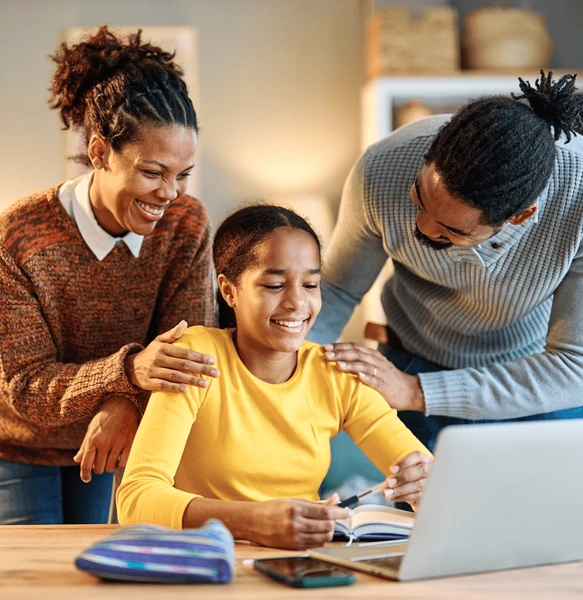 Parents supporting their child with schoolwork